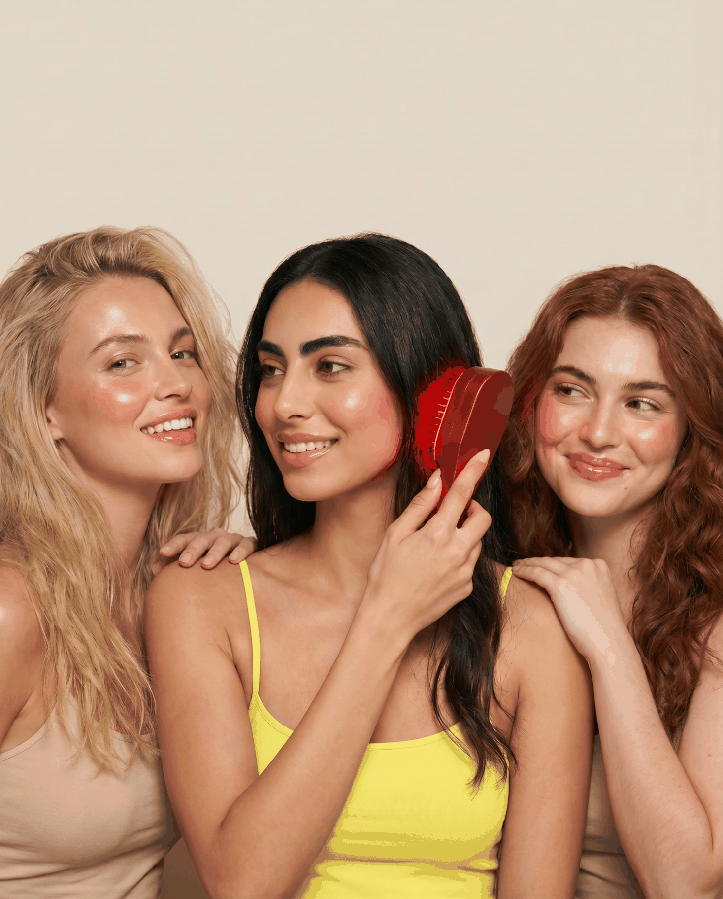 Three women using the Nova red light scalp brush together